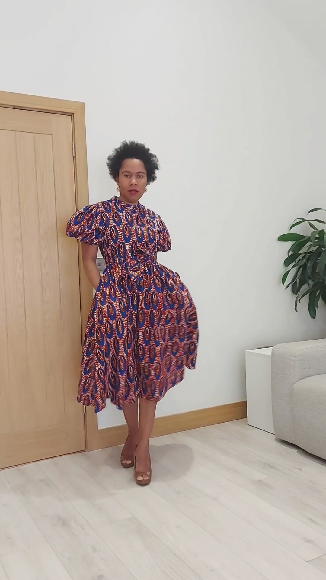 Load video: Green African Print Midi Dress with Puff Sleeves | Ankara Belted Dress | MADE INSIDE